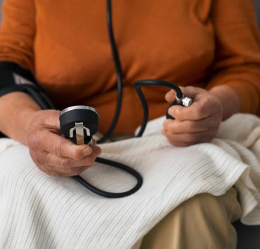 Older person checking their blood pressure with tensiometer - Naija Fitfam