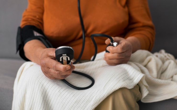 Older person checking their blood pressure with tensiometer - Naija Fitfam
