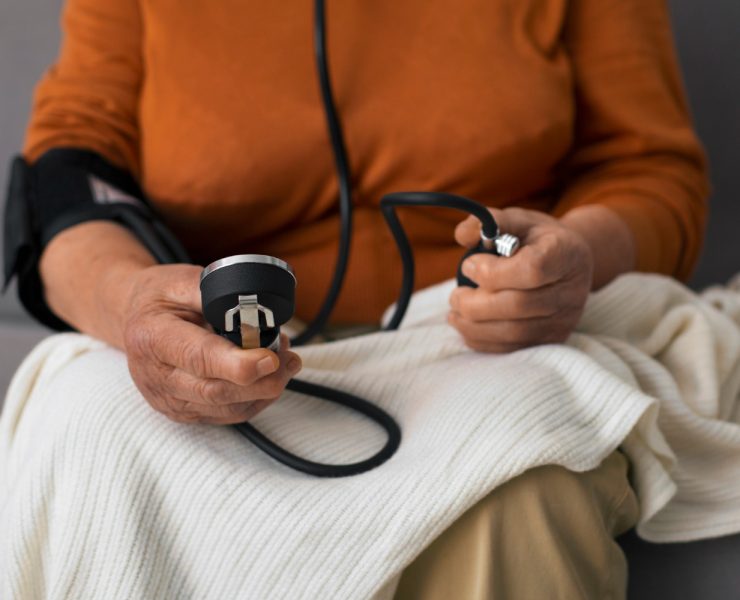 Older person checking their blood pressure with tensiometer - Naija Fitfam