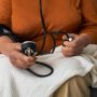 Older person checking their blood pressure with tensiometer - Naija Fitfam